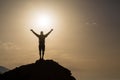 Man with arms outstretched celebrate mountains sunrise Royalty Free Stock Photo