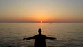 A man in front of the sea during a sunset Royalty Free Stock Photo