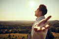 Man with arms wide open standing outdoors Royalty Free Stock Photo