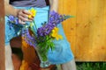 Man arranging bouquet in a crystal vase