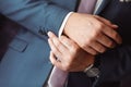 Man arranging his buttonholes Royalty Free Stock Photo