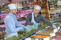 Man arranging trays food in buffet counter Royalty Free Stock Photo