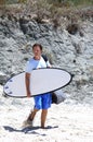 Man arriving at the beach to surf Royalty Free Stock Photo