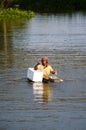 Man asia local fisher working by cast a net in canal country Thailand