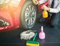 Man asian inspection and cleaning Equipment car wash With red car For cleaning
