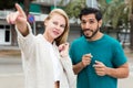 Man is asking woman stranger about road to hotel