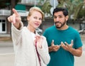 Man is asking woman stranger about road to hotel Royalty Free Stock Photo
