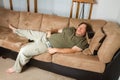 Man asleep on the couch Royalty Free Stock Photo