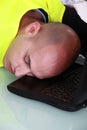 Man asleep at his desk Royalty Free Stock Photo
