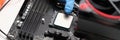 Man assembles components to build computer closeup