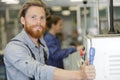 man assembles electronic components on machine Royalty Free Stock Photo