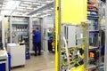 man assembles electronic components on a machine in a factory for mechanical engineering Royalty Free Stock Photo