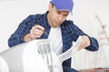 Man assembling air conditioning unit Royalty Free Stock Photo