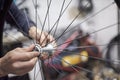 Man assembling a bike wheel axle as part of a bicycle maintenance service