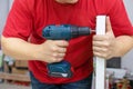 Man assembling DIY furniture using electric drill Royalty Free Stock Photo