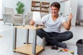 The man assembling furniture at home Royalty Free Stock Photo