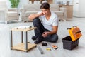 The man assembling furniture at home Royalty Free Stock Photo