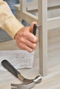 Man assembling the stool Royalty Free Stock Photo