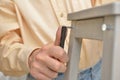 Man assembling the stool Royalty Free Stock Photo