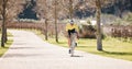 Man, athlete and bike path in park, exercise and training of triathlon sports in sunshine. Cyclist, bicycle and outdoor