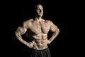 Man athlete with fit torso muscles. Bodybuilder with six pack and ab. Sportsman show biceps and triceps. Sport power and