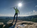 Man athlete runner with trekking poles running rocky trail Royalty Free Stock Photo