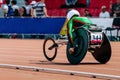 man athlete in wheelchair racing track stadium in para athletics championship