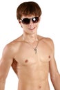 Man with athletic body posing in sun glasses