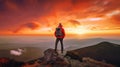 The man atop the red mountain gazed at the setting sun and orange clouds with a backpack. Serenity abounds. Generative AI