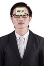 Man attach a help text on forehead Royalty Free Stock Photo
