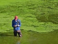 Man attaches fly to fishing line