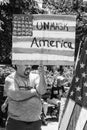 A Man Holds a Sign that Says Unmask America Royalty Free Stock Photo