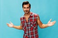 Man attractive confident blue shirt arm friendly happy background trendy smile travel plaid guy