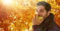 Man in Autumn eating pear in forest Royalty Free Stock Photo