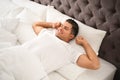 Man awakening on bed at home. Lazy morning Royalty Free Stock Photo