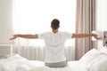 Man awakening on bed at home Royalty Free Stock Photo