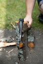 A man with an ax chopping logs. Ax in wood chock Royalty Free Stock Photo