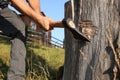 Man with axe cutting wood outdoors, closeup Royalty Free Stock Photo