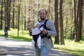 Man with baby carrier Royalty Free Stock Photo