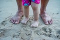 Feet father and daughter standing in sand Royalty Free Stock Photo