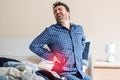 Man with back pain in bed feeling pain Royalty Free Stock Photo