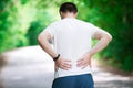 Man with back pain, kidney inflammation, trauma during workout Royalty Free Stock Photo