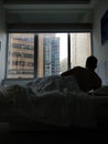 Man back shot on bed naked on morning in Hong Kong