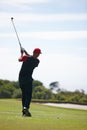 Man, back and swing with golf course for stroke, point or strike on grass field in nature. Rear view of male person Royalty Free Stock Photo