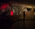 Man on the background of the Prometheus cave in Georgia