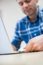 Man Backing Up Computer Data Onto Memory Stick