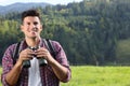 Man with backpack and binoculars in mountains Royalty Free Stock Photo