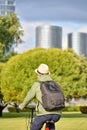 Man with backpack, cyclist on a bicycle while biking around the city