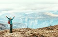 Man with backpack emotional happy raised hands