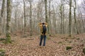 Man with backpack and hands in head walking in forest.Lost in the forest ,lonely concept.Sadness and depression lifestyle outdoors